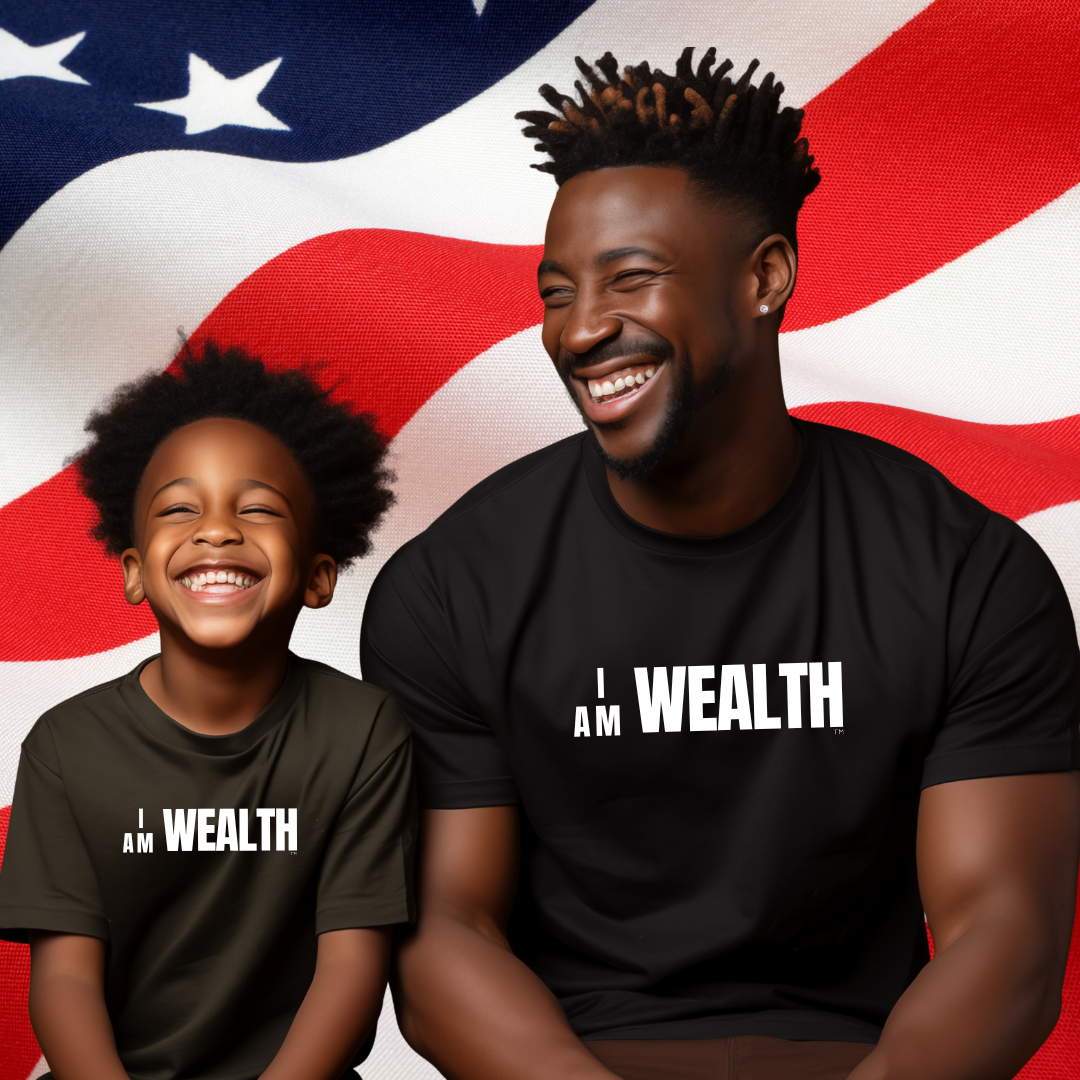 black t-shirt set against American flag background. shirt design has bold white text reading I AM WEALTH across the chest.  Small upper back print reads Ideas, Ingenuity, Innovation, Imagination. 